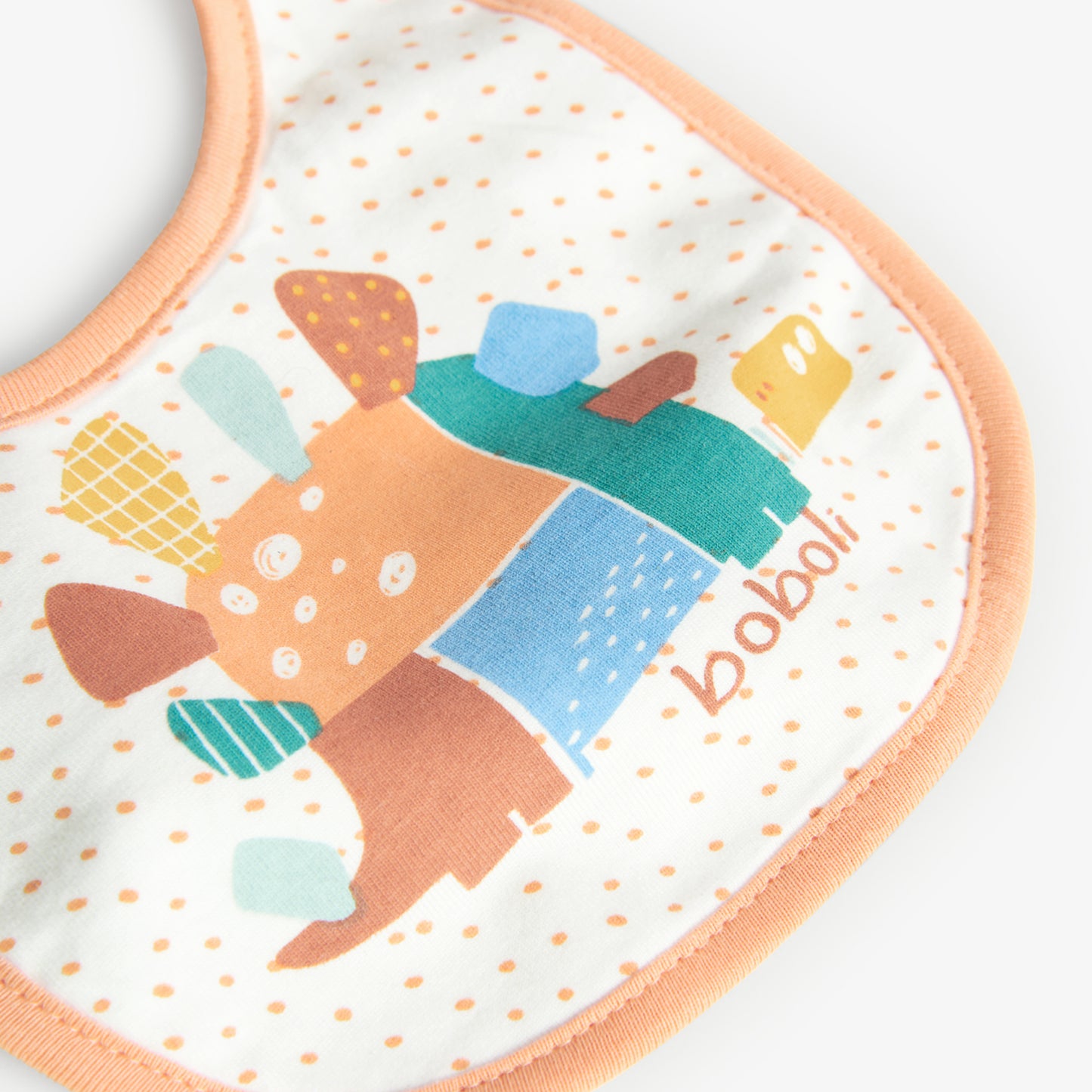 Babero Boboli Dots y Dinos Naranja